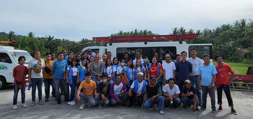 The Bicol operations team gathered with a service vehicle on a provincial road